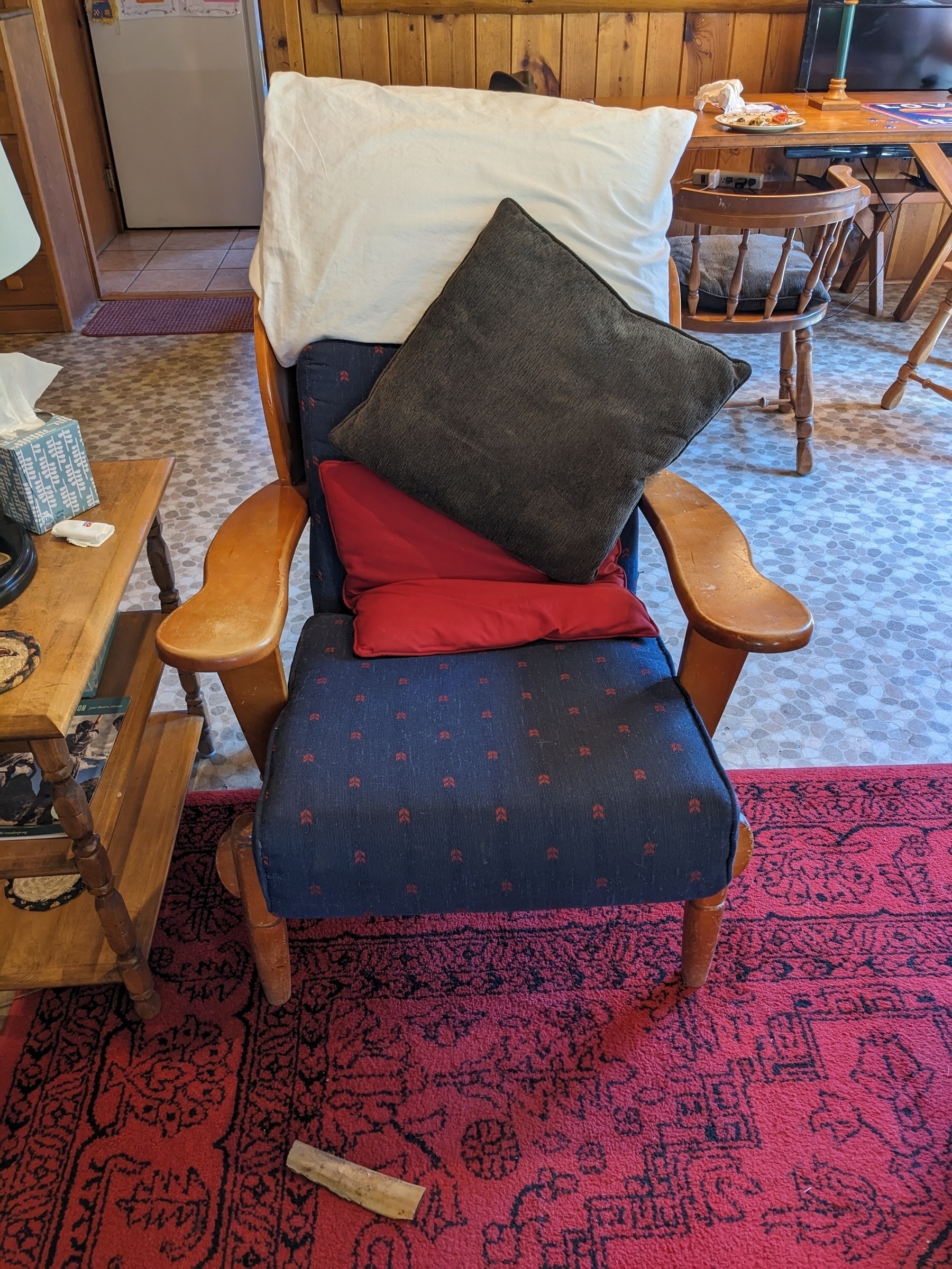 a chair with colorful pillows