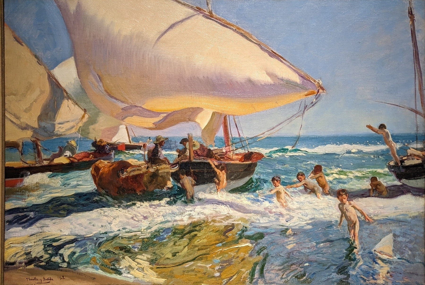 Oil painting - seashore with a small boat with a billowing sail and small naked children playing in the waves
